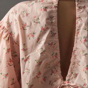 Anthropologie Pink Floral Bubble Sleeve and Tie Bottom Blouse with an Open Back